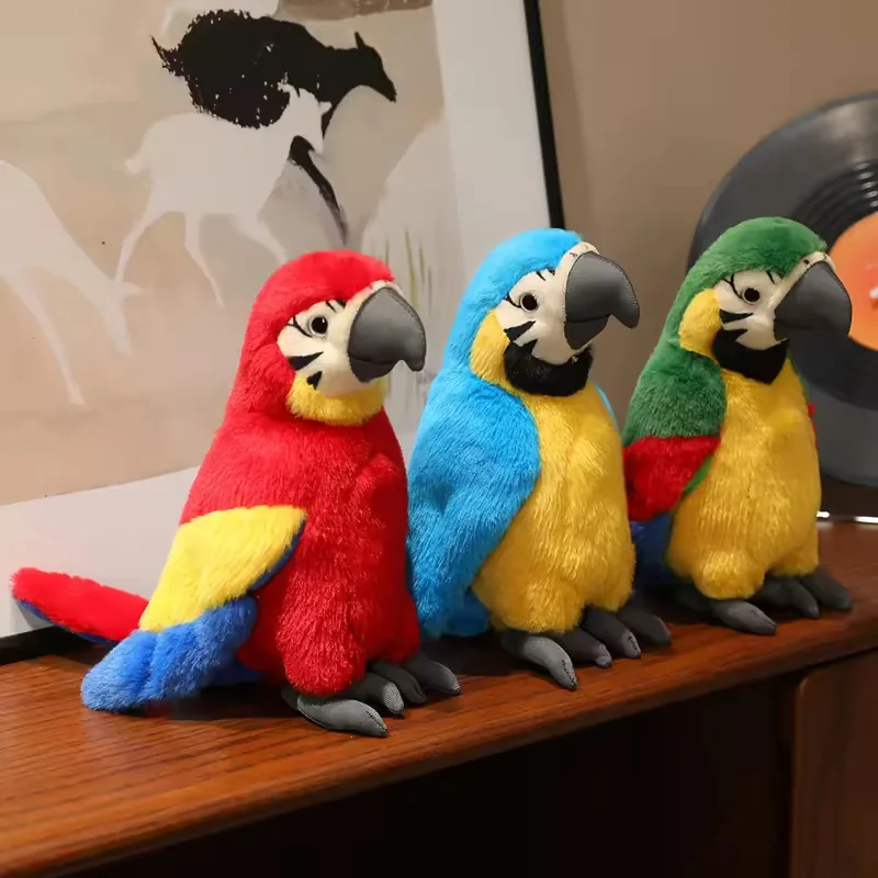 Three colorful plush parrot toys in red, blue, and green macaw-inspired colorways displayed together on a wooden shelf