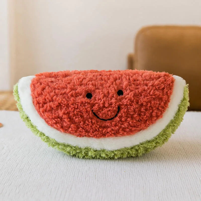Cojín de peluche con forma de rodaja de sandía, cara sonriente y contraste verde en la corteza
