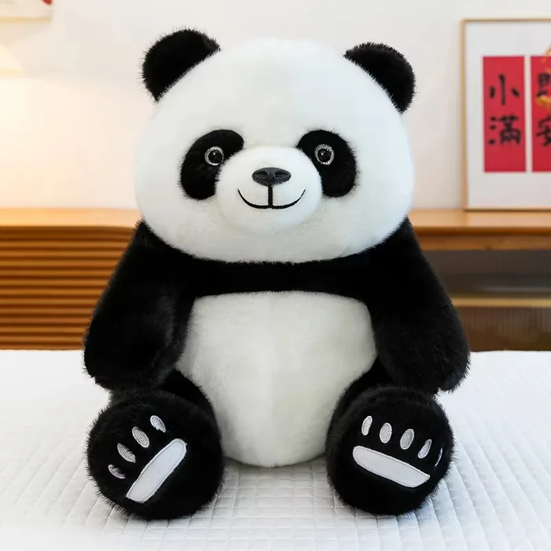 Soft seated panda plush toy with rounded white face, black arms, and embroidered paw pads