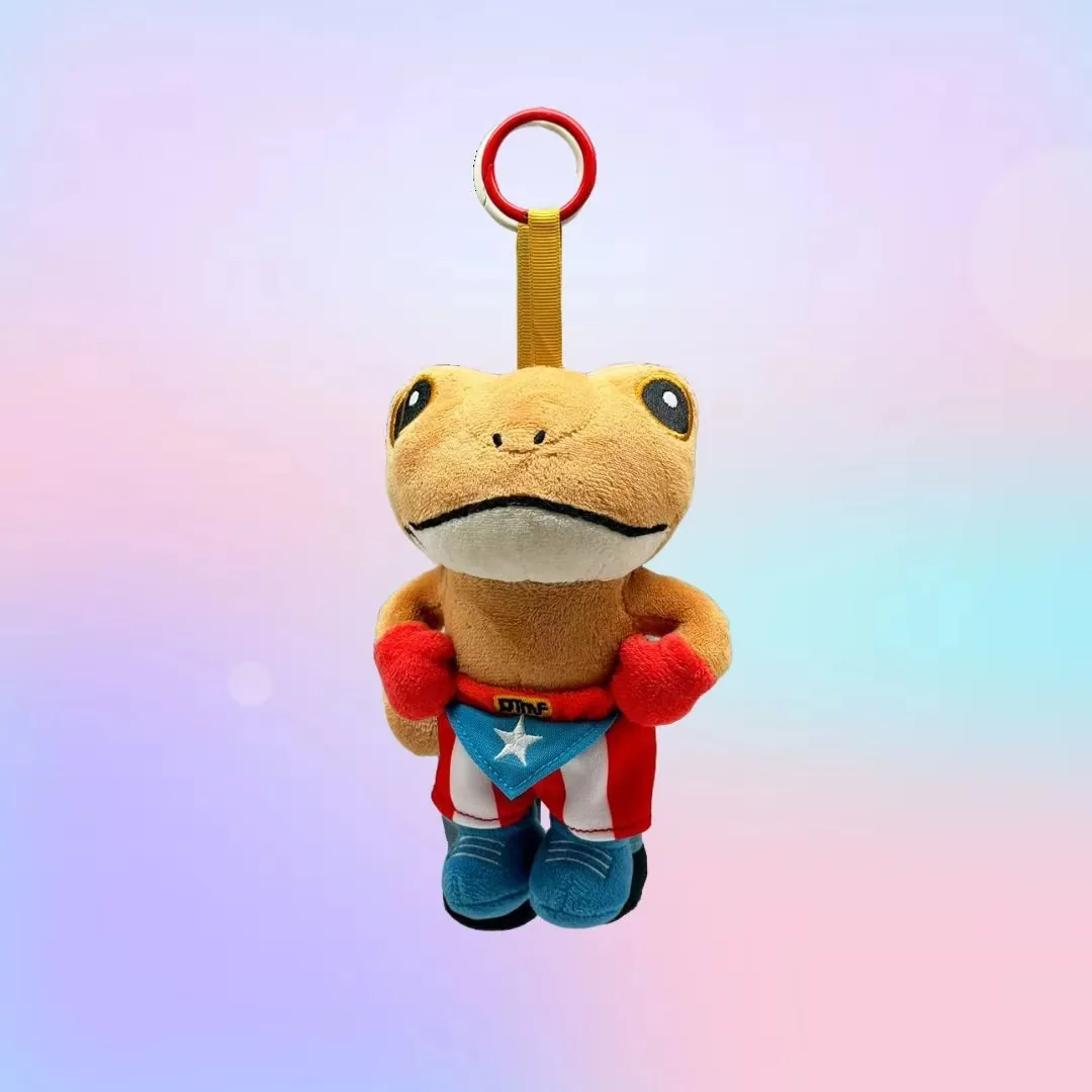 Llavero de rana de peluche con capa roja de superhéroe y bufanda azul con emblema de estrella