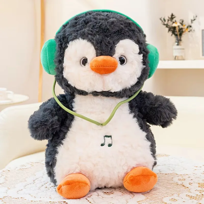 Muñeco de peluche de pingüino con auriculares único, con pelo gris oscuro suave, barriga blanca y pico y patas naranjas