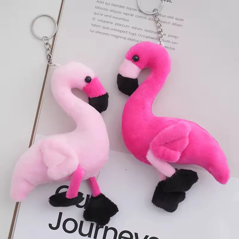 Light pink and hot pink flamingo keychain plush charms displayed side by side with silver hanging rings