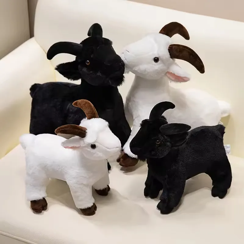 Four realistic goat plush toys in black and white colorways with curved horns and short standing farm-animal bodies