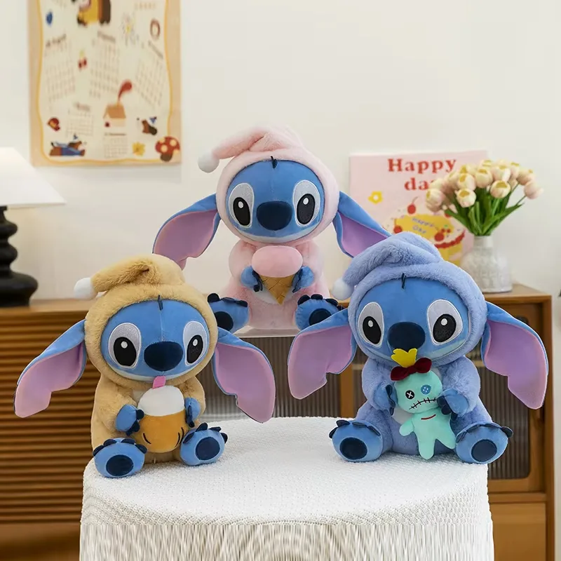 Three Stitch hooded plush dolls shown in tan, pink, and blue outfits with drink, ice cream, and Scrump accessories