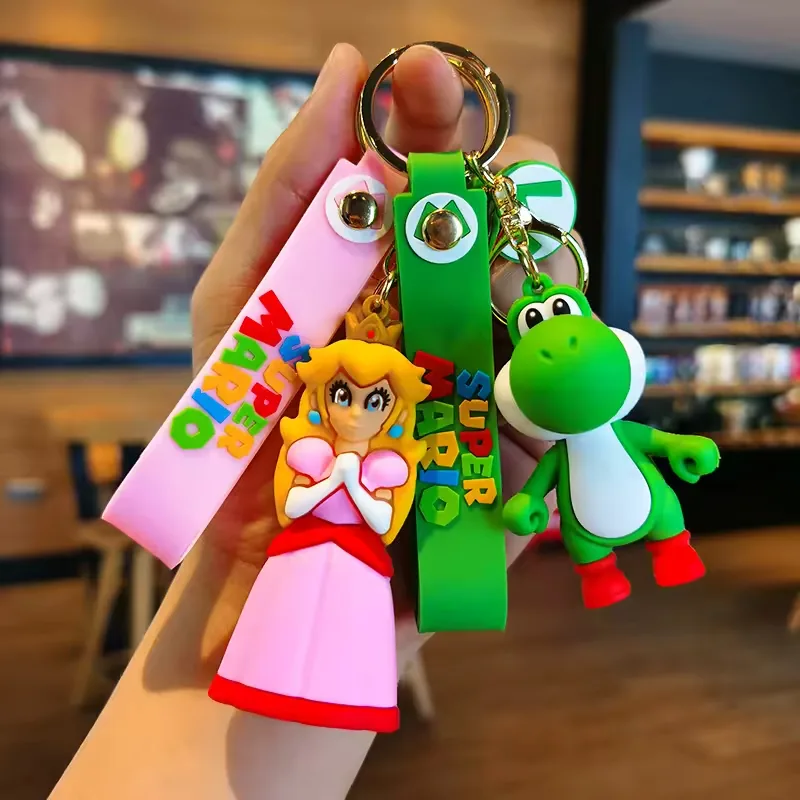 Surtido de llaveros PVC de Super Mario Bros mostrado junto para comparacion multi SKU y planificacion de merch